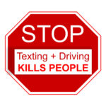 Stop sign that reads texting + driving