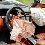 airbags deployed inside of car after frontal collision with another vehicle